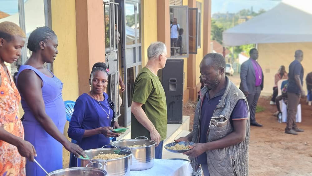 Volunteers serving meals to the community at the Ghetto Kitchen outreach